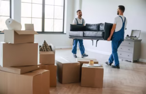 Movers lifting a sofa during home relocation